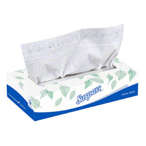 A box of Surpass Facial Tissues with a partially pulled-out tissue, adorned with a leaf pattern and labeled "Surpass" and "Facial Tissue.