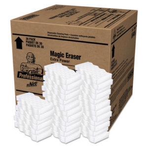 A large cardboard box labeled "MR CLEAN MAGIC ERASERS 30/CASE" with numerous white eraser pads stacked in front of it.