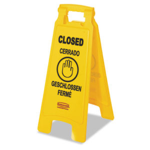 A yellow RM CLOSED sign, measuring 11X12X25 inches and constructed from plastic, displays the word "CLOSED" in English, Spanish, German, and French along with a hand symbol indicating stop. This is a two-sided multilingual sign.