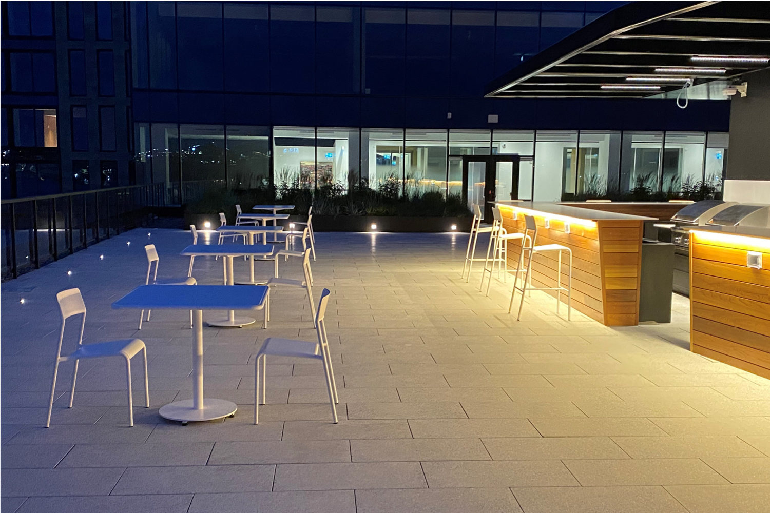 FORO-tables-chairs_stewart-mckelvey Night shot of Foro tables and chairs on roof top patio