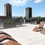 Grey Flex Pannels and wood chaise lounge chairs on rooftop