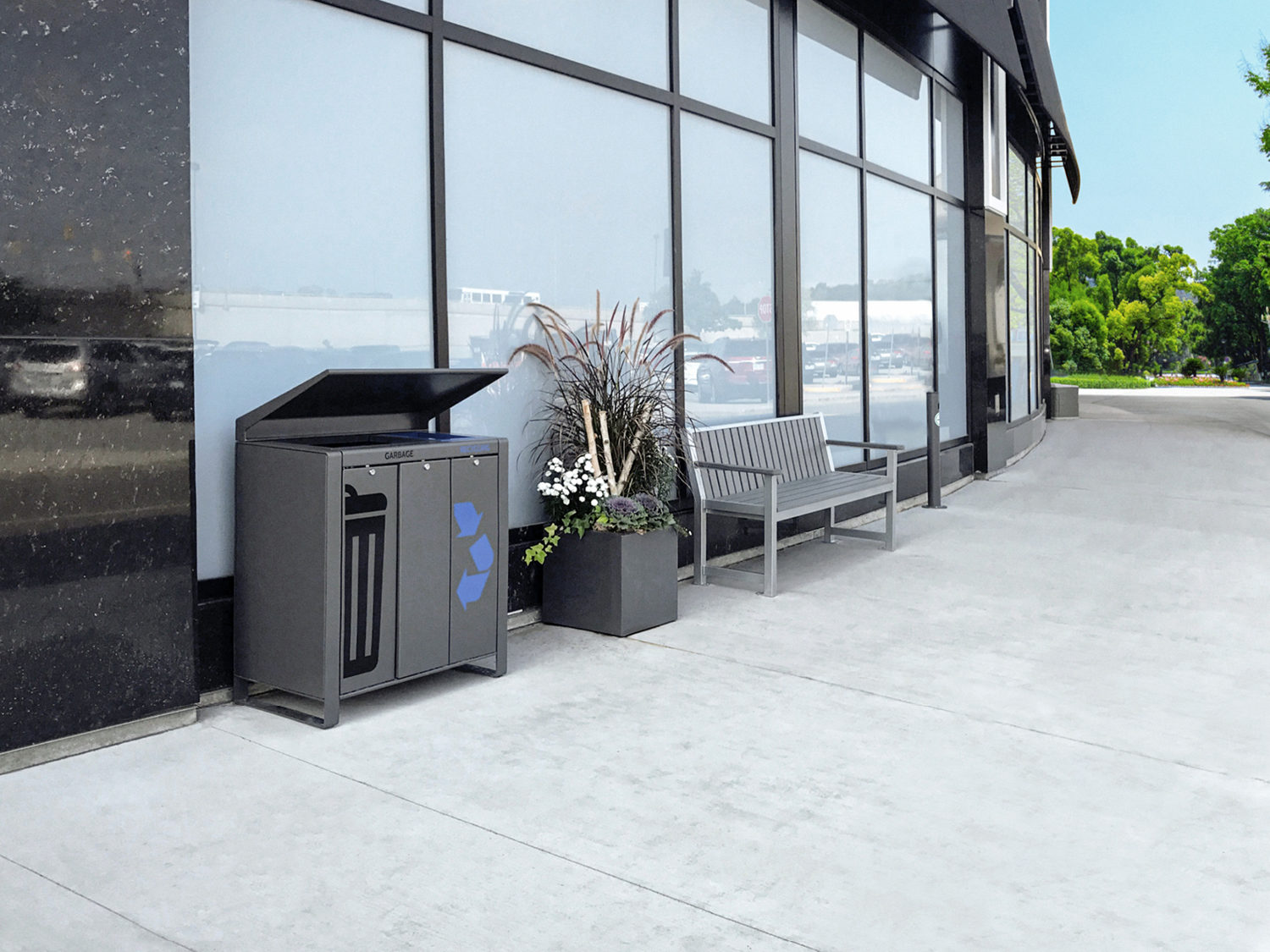 Lexicon trash/recycle, planter and bench on side walk in front of building
