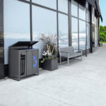 Lexicon trash/recycle, planter and bench on side walk in front of building