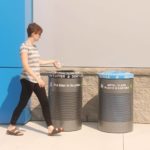 Woman throwing trash into a 600 series trash container