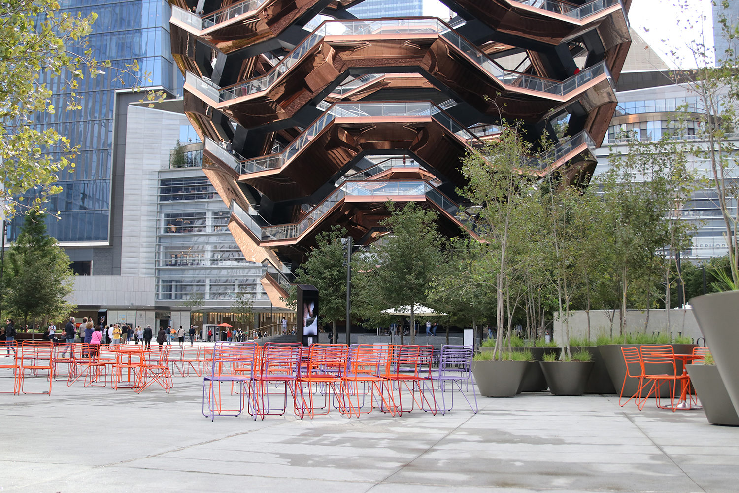 Brightly painted Kontur Chairs looking at the Vessel in NY