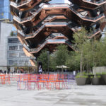 Brightly painted Kontur Chairs looking at the Vessel in NY