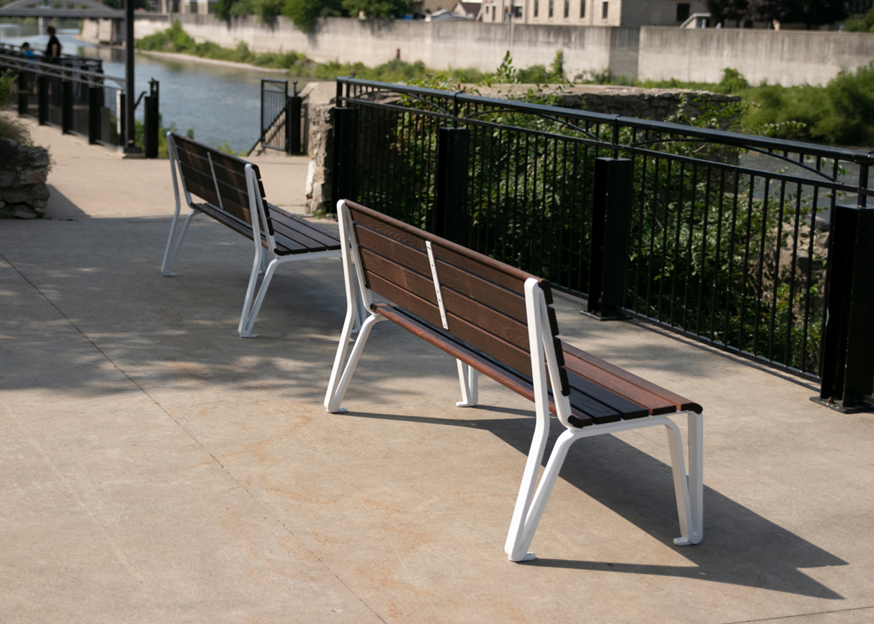 Two Backed Benches Facing Water