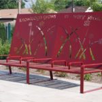 Red Bench with Large back with floral design and text 