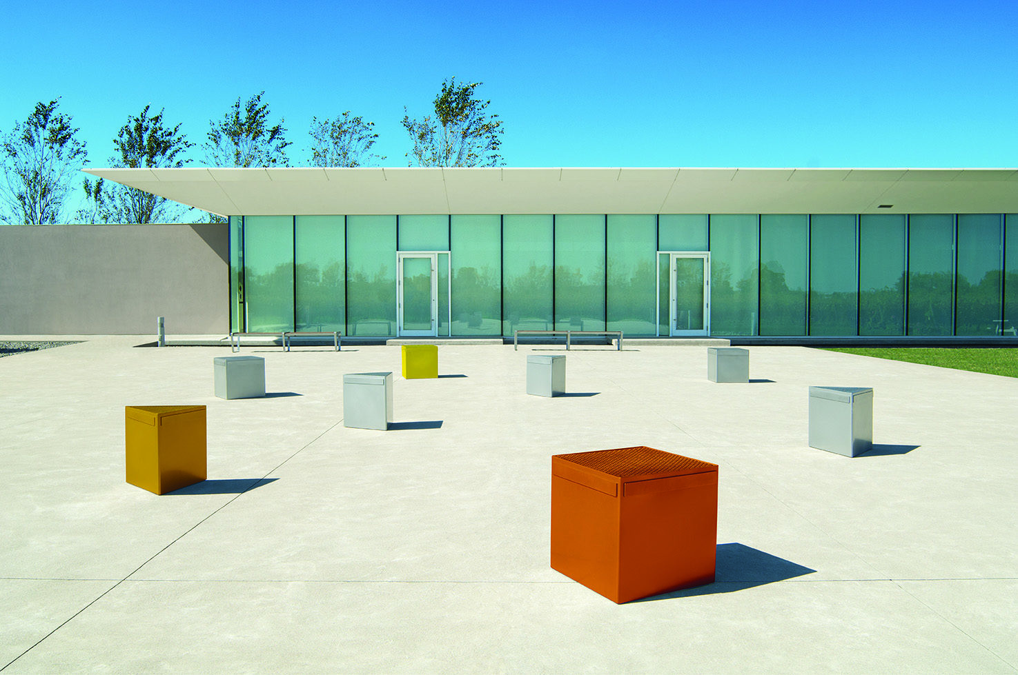 Lexicon steel seating modules in metallic colors in front of a modern building
