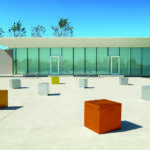 Lexicon steel seating modules in metallic colors in front of a modern building