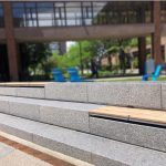 Wall-mount Ogden seats with Thermally Modified Ash Wood in university courtyard