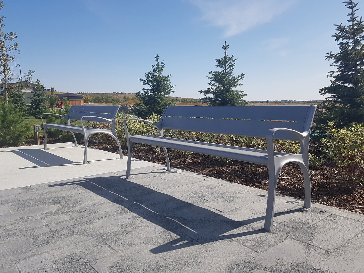 Painted Silver 14 870 backed benches with arms in park setting