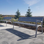 Painted Silver 14 870 backed benches with arms in park setting