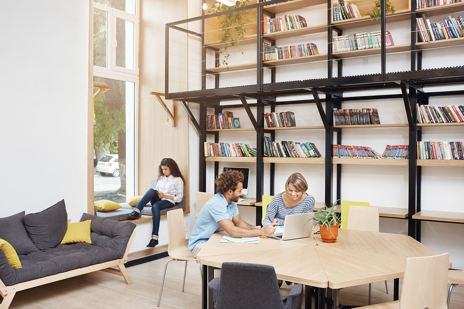 Resources library with students helping one another