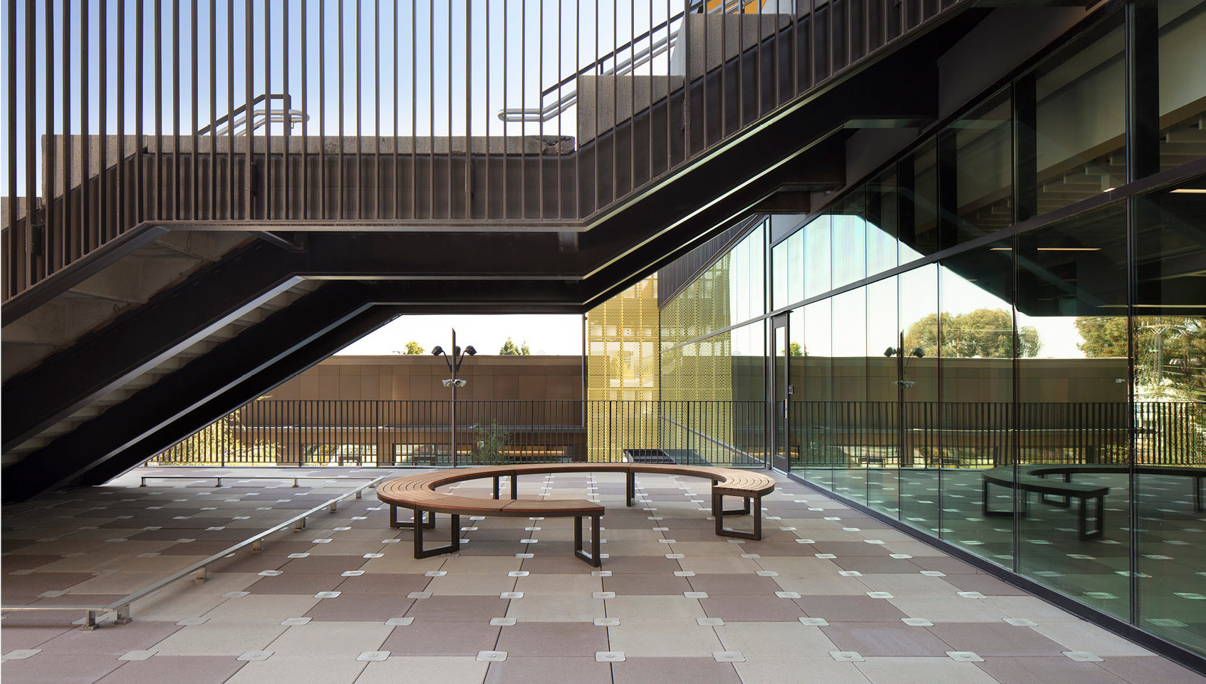 Ogden Collection - Circular Bench Circular Ogden Bench under staircase at Menlo Park High School