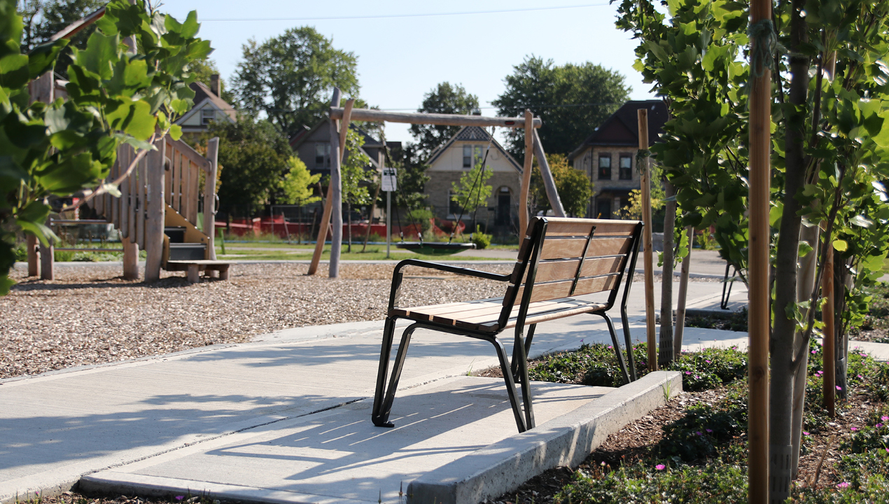 MBE-2300-00017: Iconic Backed Bench with Arms, Ipe Wood Seat and Back in park