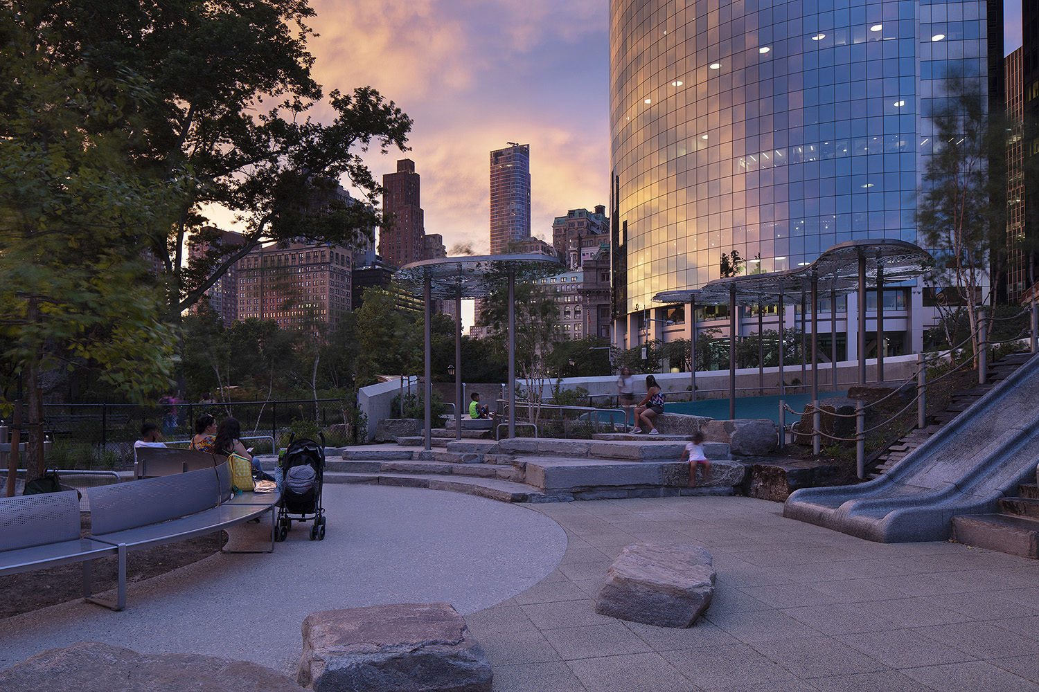 Battery-Playscape_night_custom-curved-bench_shade-clouds_001 View of the Battery Playscape at twilight