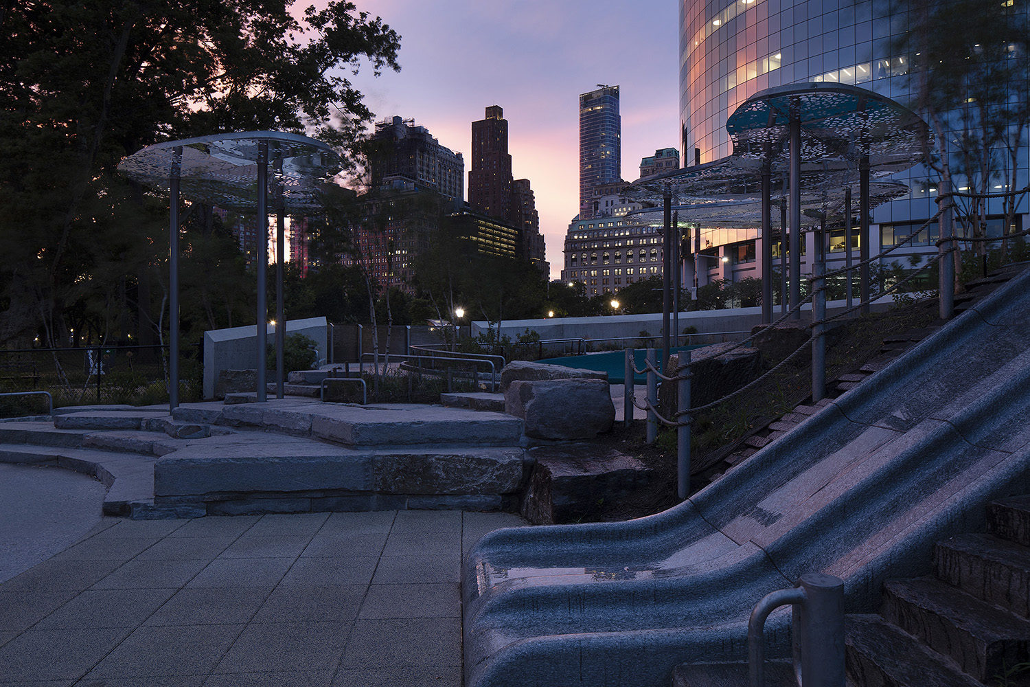 Battery-Playscape_night_shade-clouds_001 The Battery Playscape at twilight, showing the granite slides and custom cloud canopies