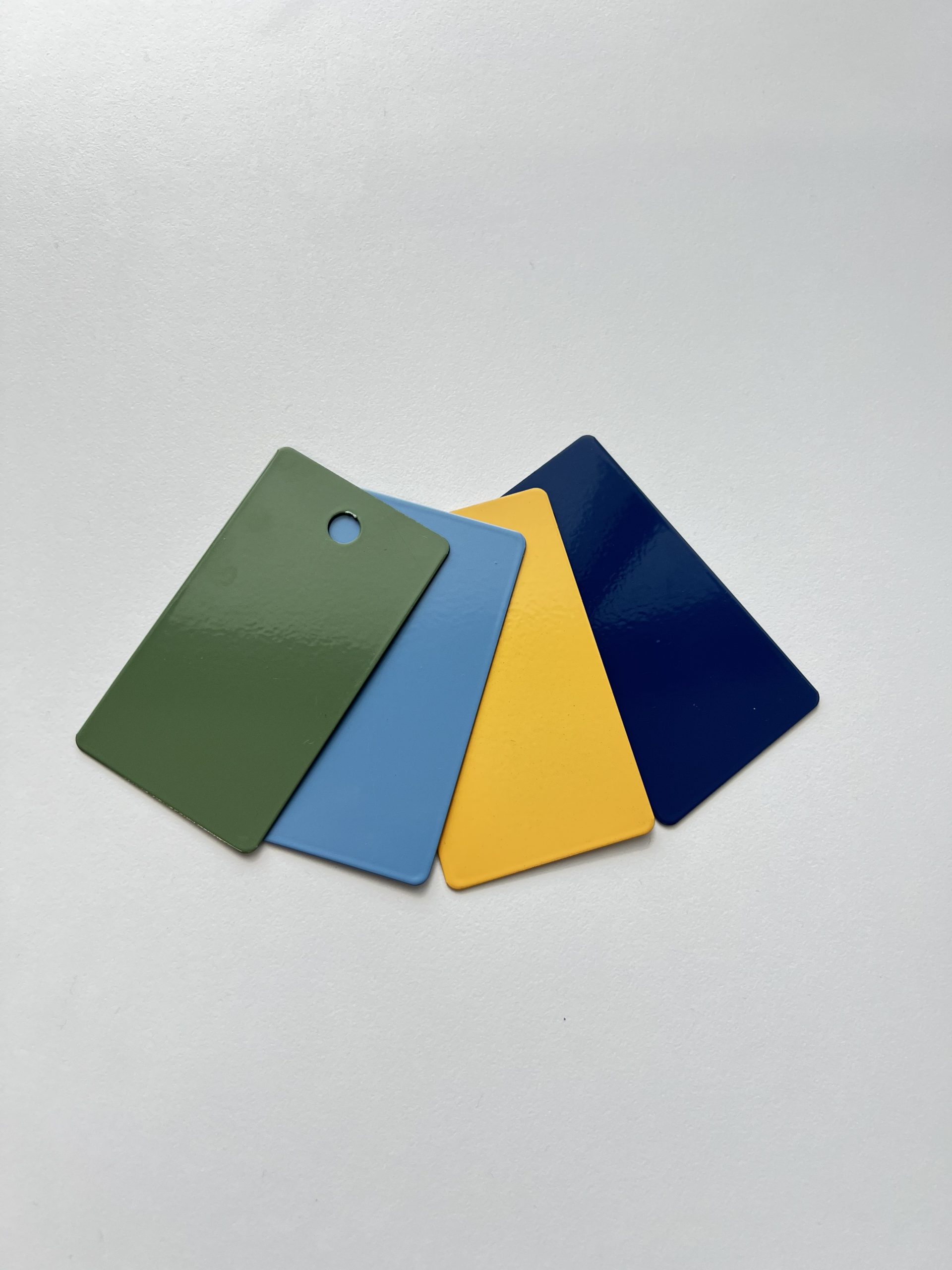 Image of four powdercoat paint chip samples.