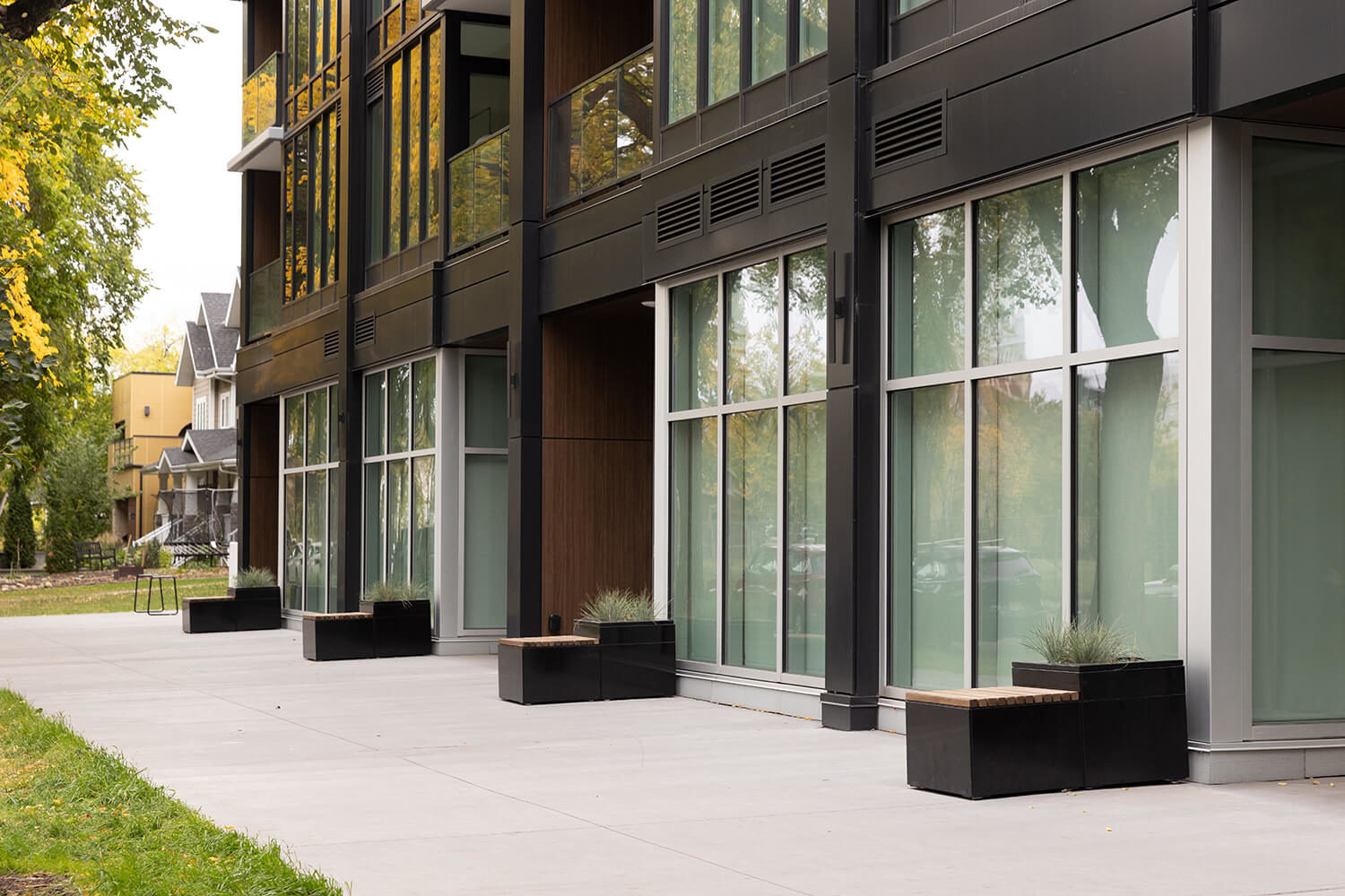 maglin_pixel-collection_black-blocks Maglin Pixel blocks line an apartment building on the sidewalk