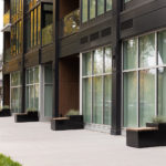 Maglin Pixel blocks line an apartment building on the sidewalk