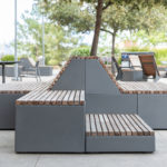 Pixel blocks on school yard patio with student and trees in background