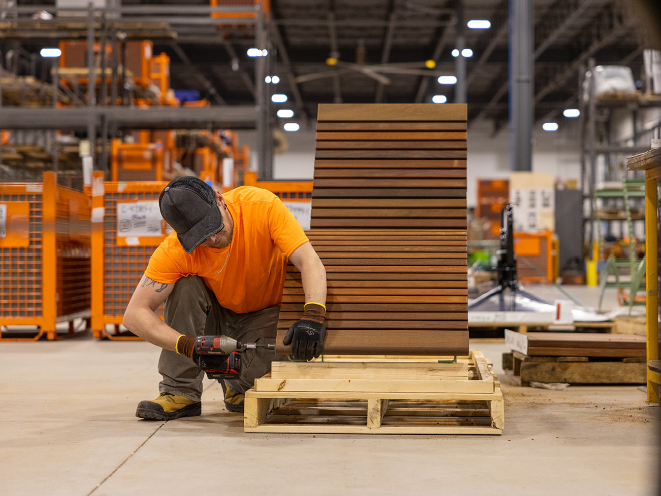 Maglin employee assembling 720 chaise lounge in warehouse