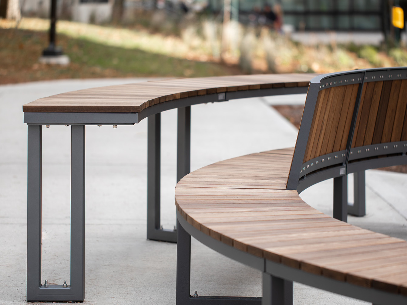Curved Ogden backed and backless bench with modular curved table