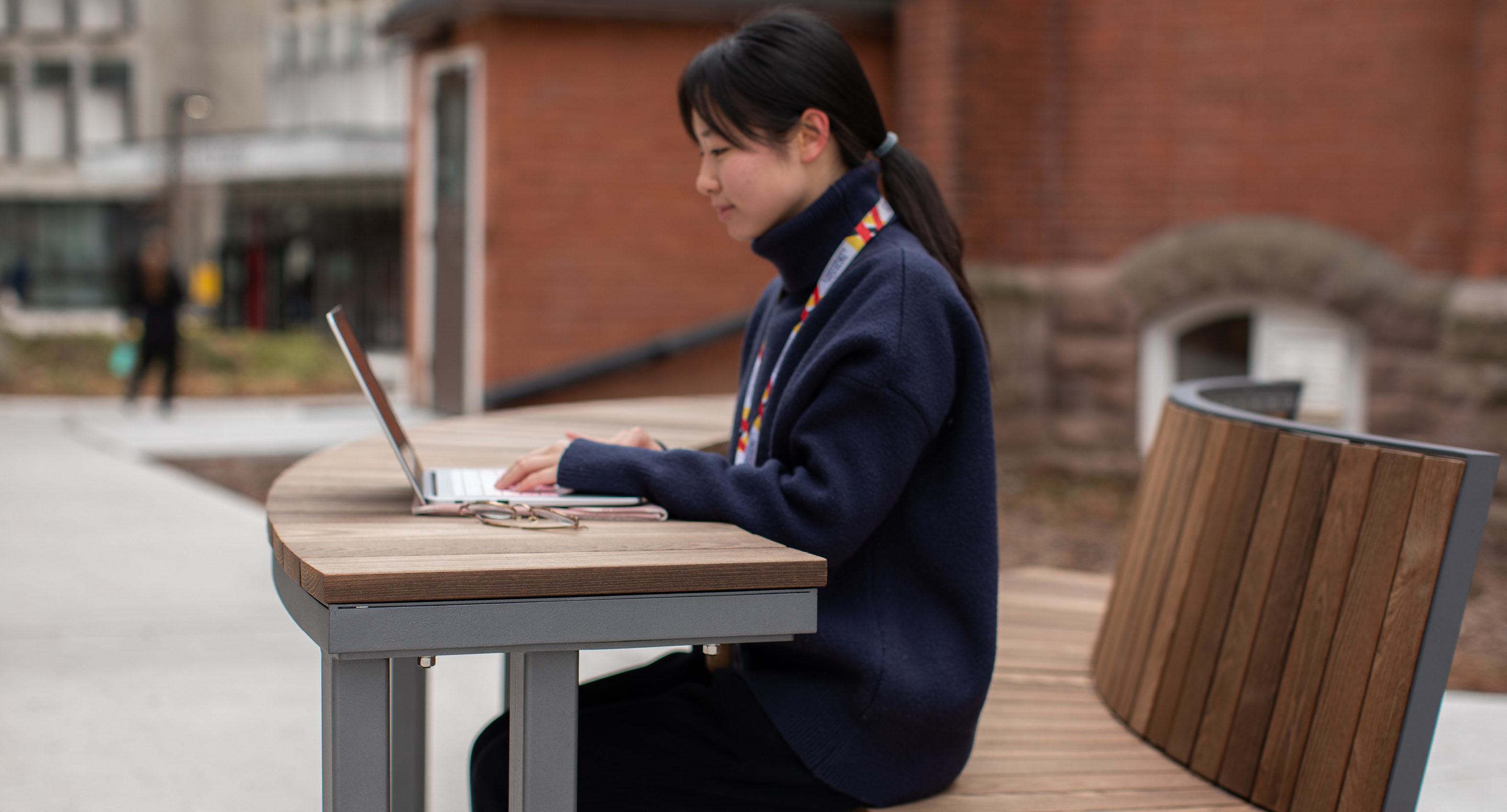 Student sitting at Ogden modular table with laptop