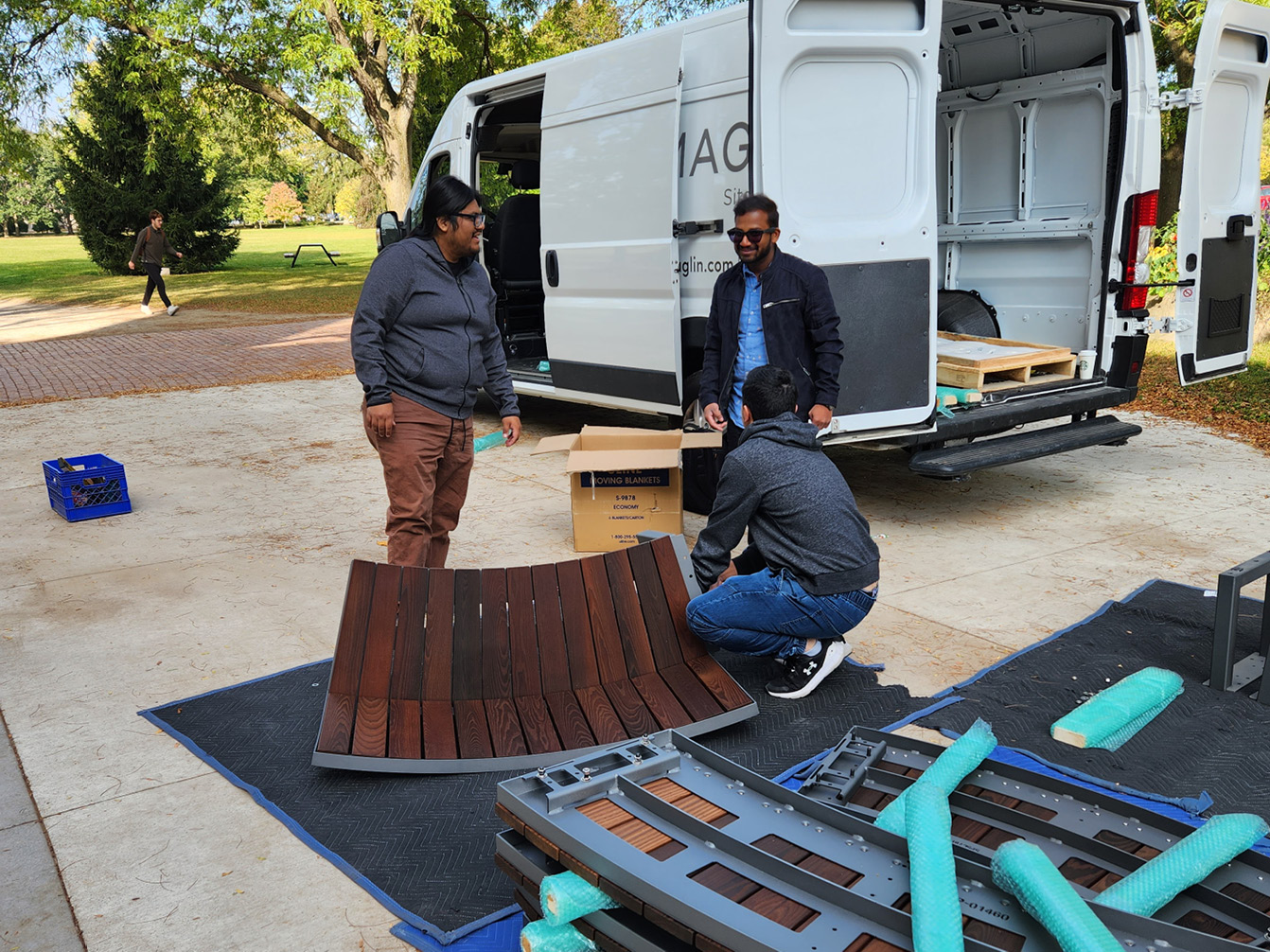 Edgar, Vidu and Shane organizing Ogden bench sections for installation