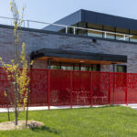 Red FLEXX panels surrounding patio at firehouse
